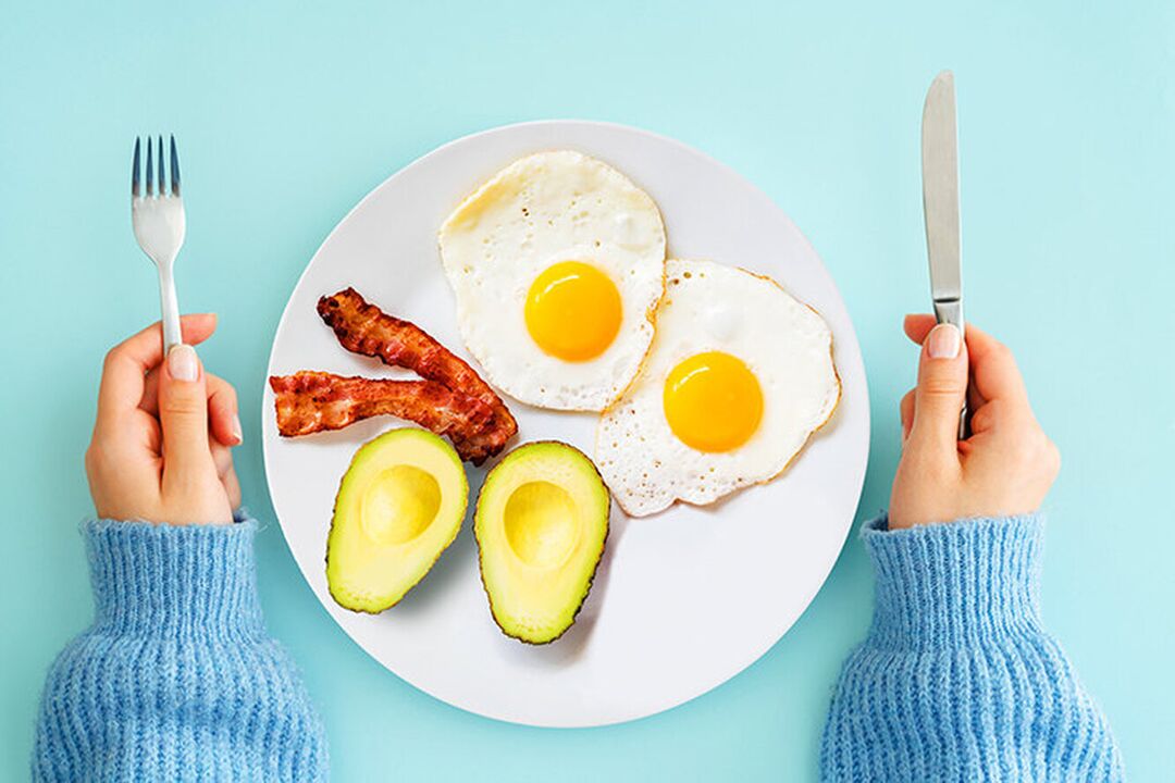 The perfect breakfast in the keto diet menu - eggs with bacon and avocado